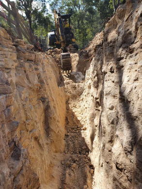 Trench digging with excavator sandstone clay trench digging and pipe installation preparation with excavator